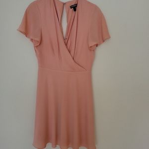 Pink Mini Dress with curtwin sleeves drop neck and eyelet back opening.